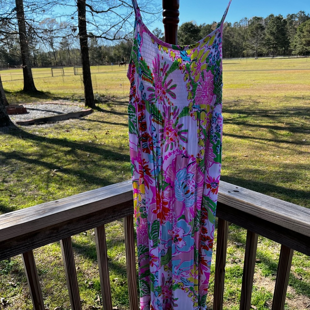 Lilly Pulitzer spaghetti strap, sundress with layered frills on the bottom.